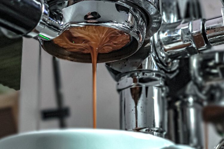 a coffee dripping from the coffee maker